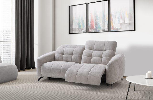 Home interior with white couch and ottoman on carpet, coffee table with candle. Minimalist light room with city view, side view, three mockup copy space frames above sofa, 3D rendering